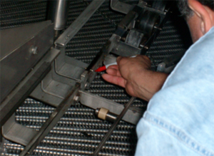 Omar Associates Expert checking a machine